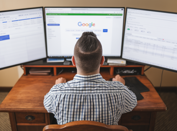 a-man-with-short-dark-hair-is-sitting-at_wDo-a9NeRi6aWOP7wv8heA_B7aSVfodTYaCKF8y4UbrmA